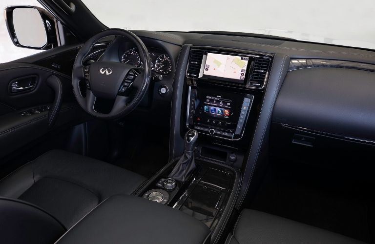 Interior view of the front seating area inside a 2020 INFINITI QX80