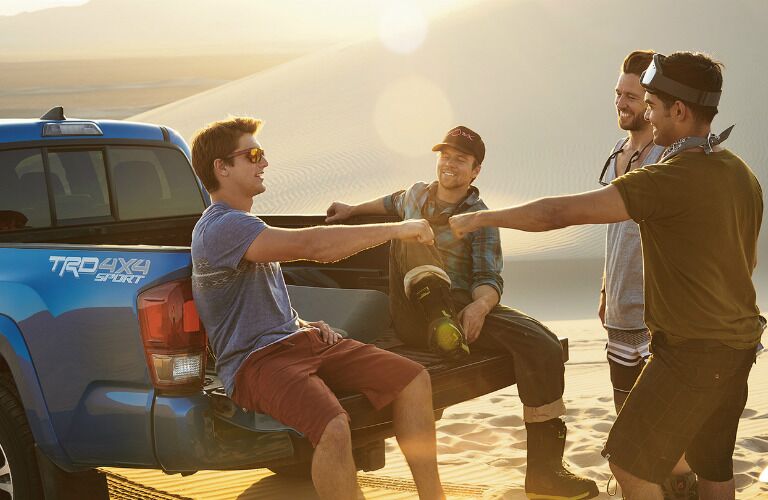 Four men on vacation in their 2017 Toyota Tacoma