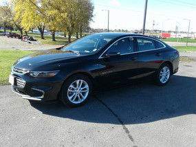 Driver's side exterior view of black Chevy Malibu