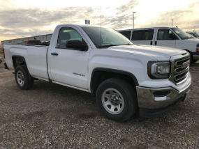 Passenger side exterior view of white GMC Sierra 1500