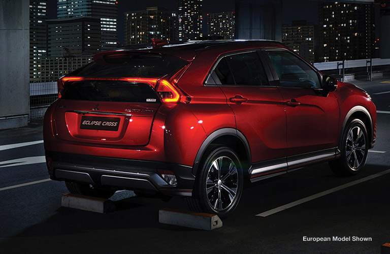 Red 2018 Mitsubishi Eclipse Cross with tail lights turned on