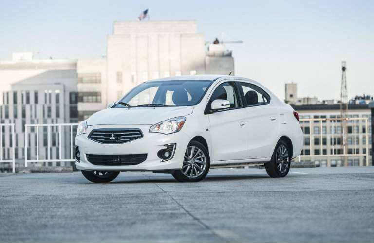 White 2018 Mitsubishi Mirage G4 parked on a city rooftop