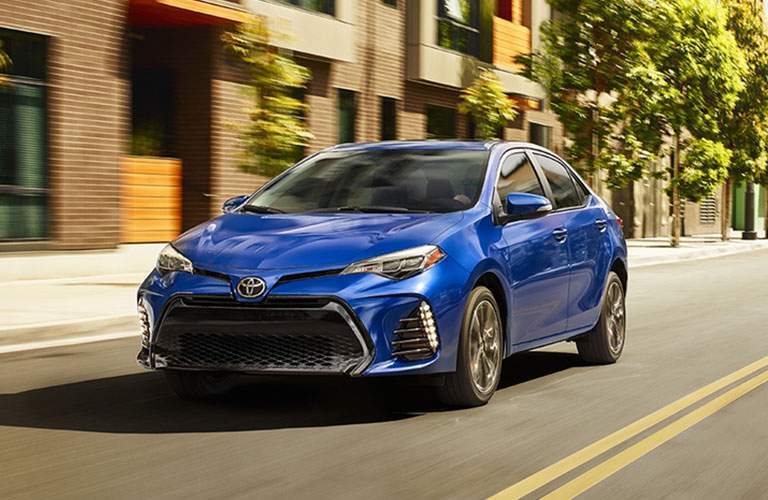 Blue Toyota Corolla in town