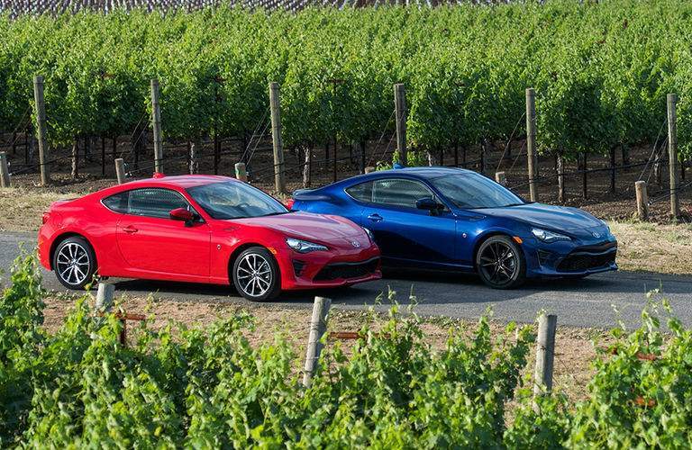 Two Toyota 86 models in a vineyard