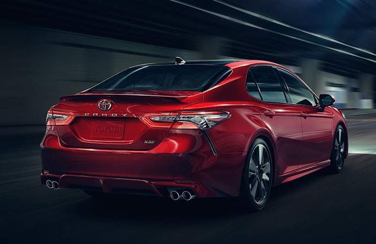 Rear profile of red Toyota Camry