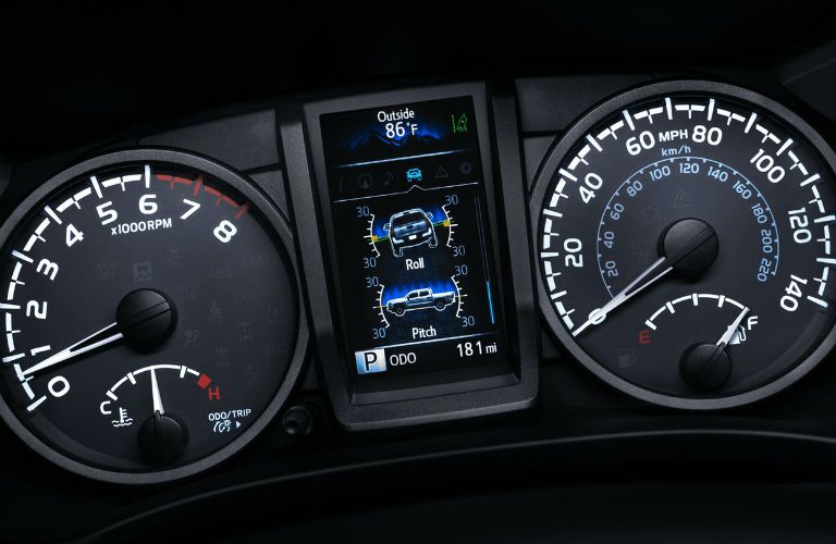 A close up photo of the center gauge cluster in the 2018 Toyota Tacoma.