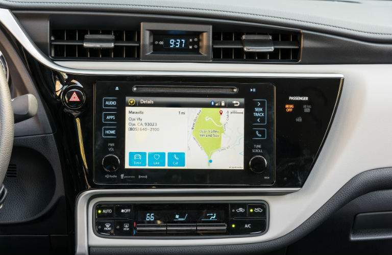 Available GPS navigation system on the touchscreen being shown in the 2018 Toyota Corolla