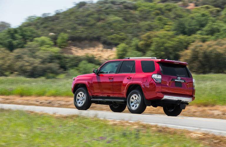 A photo of a red 2018 Toyota 4Runner showing the integrated trailer hitch that is standard equipment