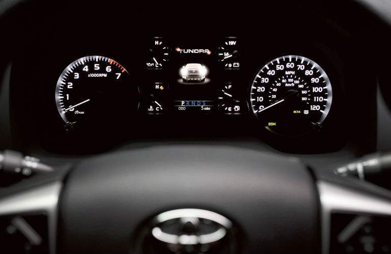 The center gauge cluster of the 2018 Tundra showing where the active safety system has its indicators