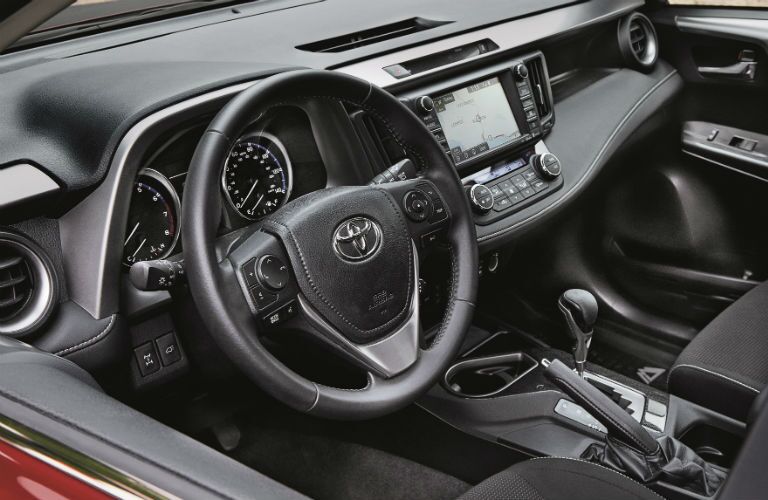 An interior photo of driver's cockpit of the 2018 Toyota RAV4.