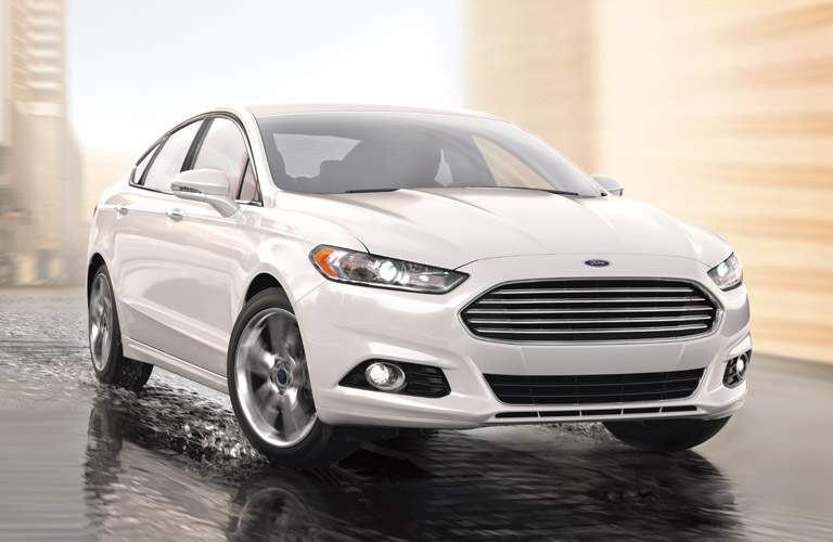 White 2016 Ford Fusion on Wet Street