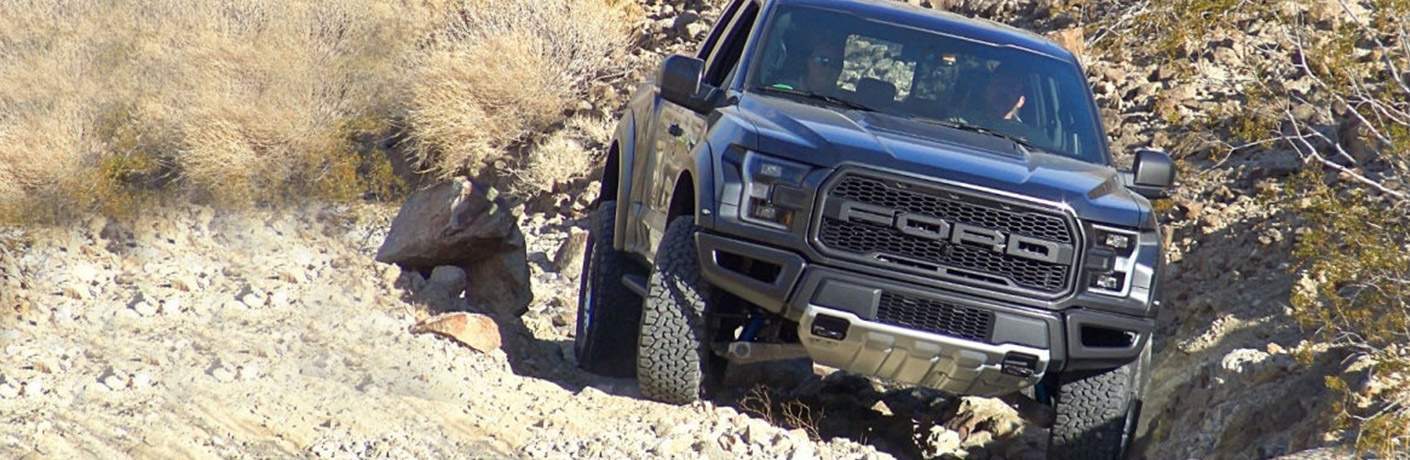 Black 2018 Ford F-150 Raptor on Rocky Incline