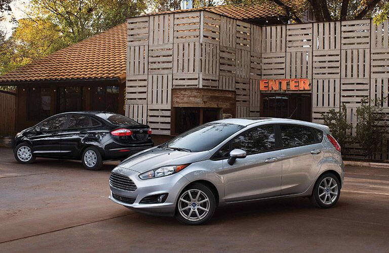 Silver 2019 Ford Fiesta Hatchback and Black 2019 Ford Fiesta Sedan in a Parking Lot