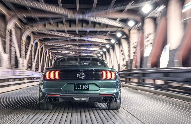 Green 2019 Ford Mustang Bullitt Rear Exterior on a Bridge