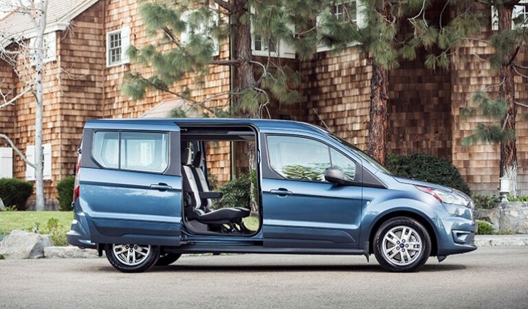 Blue 2019 Ford Transit Connect Wagon in a Driveway with Doors Open