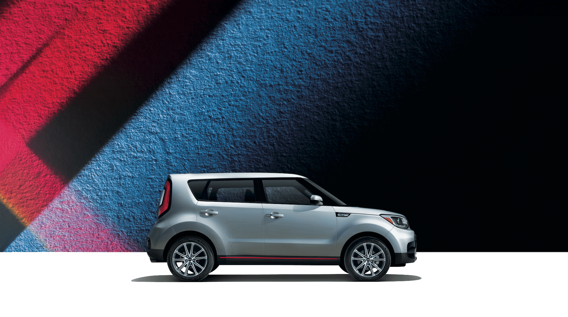 Kia Soul Base Vs Plus Exclaim Paul Cerame A Silver 2019 Kia Soul On Blue And Red Background