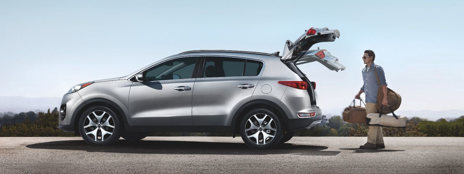 Kia Sportage with Truck Open A man opening the trunk on the 2019 Kia Sportage