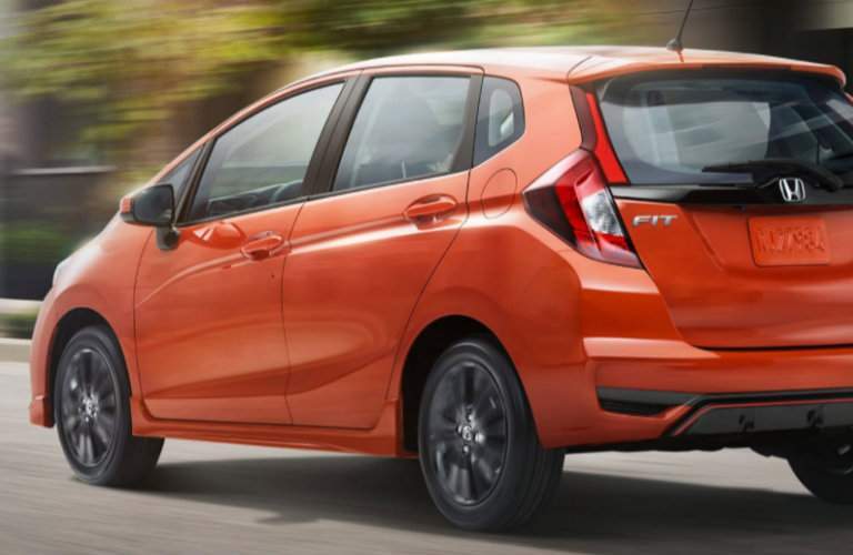 orange 2018 Honda Fit seen from the rear