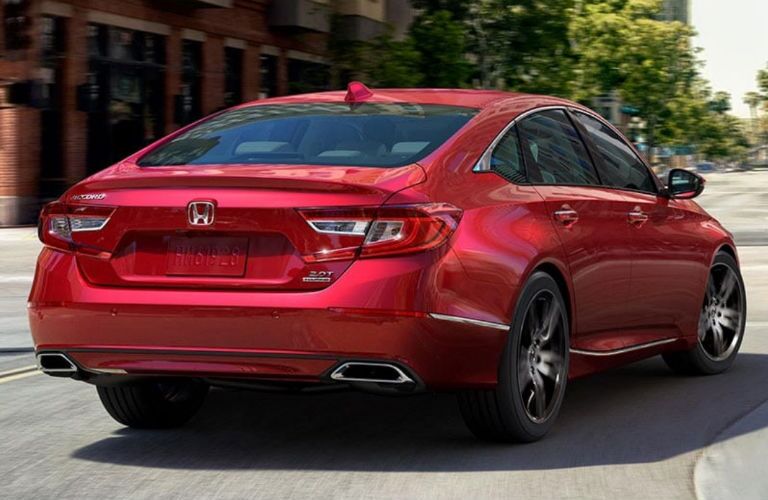 A photo of the 2021 Honda Accord going around a corner.