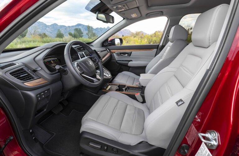A photo of the driver's cockpit and front seat in the 2021 Honda CR-V Hybrid.