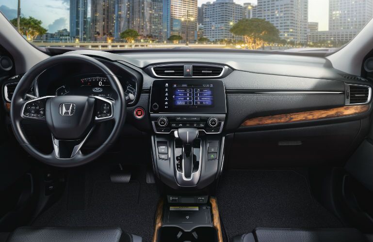 A photo of the dashboard and driver's cockpit in the 2021 Honda CR-V.