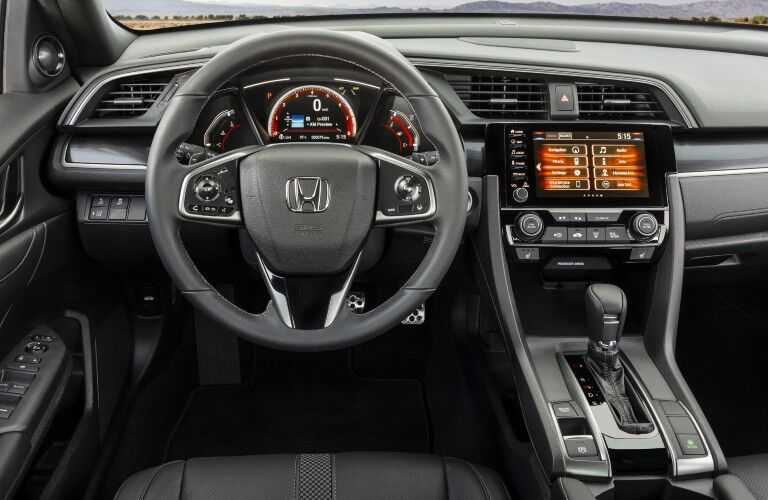 A photo of the driver's cockpit in the 2021 Honda Civic Hatchback.