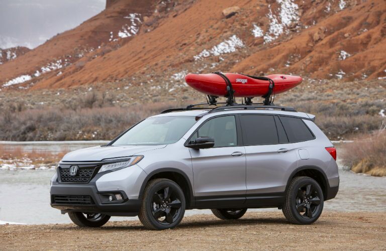 A photo of the 2019 Passport with a kayak on the roof.