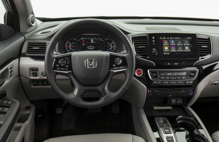 A photo of the driver's cockpit in the 2021 Honda Pilot.