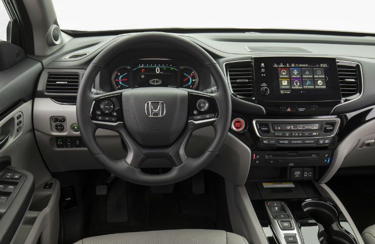 An interior photo of the driver's cockpit in the 2020 Honda Pilot.