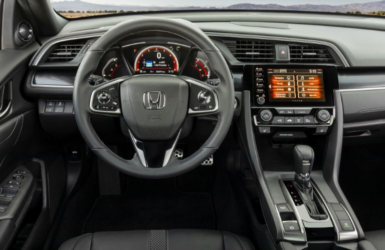 A photo of the driver's cockpit in the 2021 Honda Civic Hatchback.