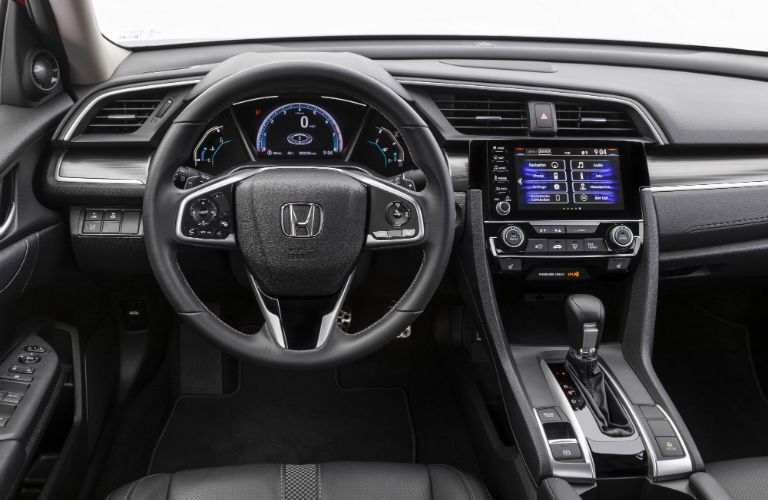 A photo of the driver's cockpit in the 2020 Honda Civic Sedan.