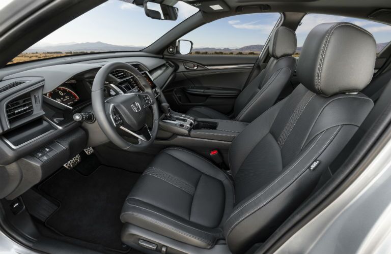 A photo of the front seats in the 2020 Honda Civic Hatchback.