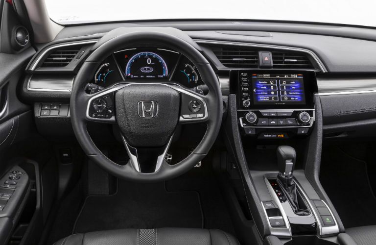 A photo of the driver's cockpit in the 2021 Honda Civic Sedan.