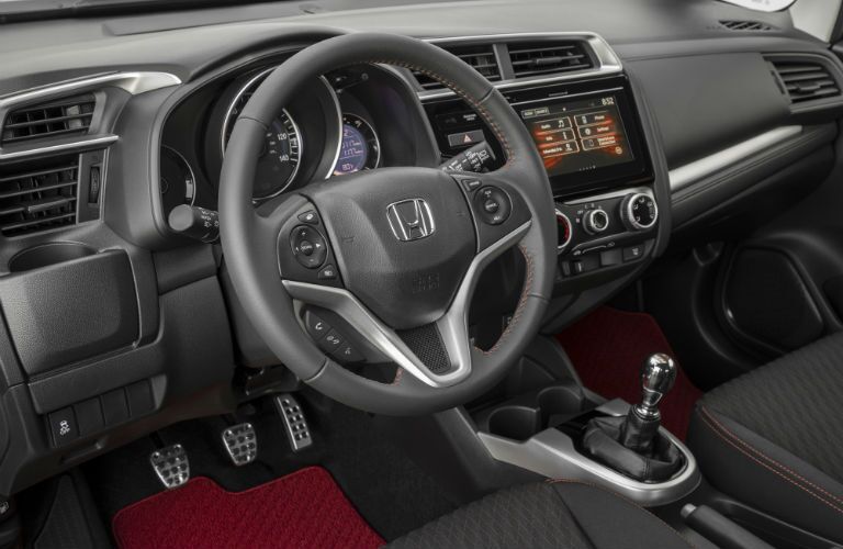 A photo of the steering wheel and center gauge cluster in the 2020 Honda Fit.