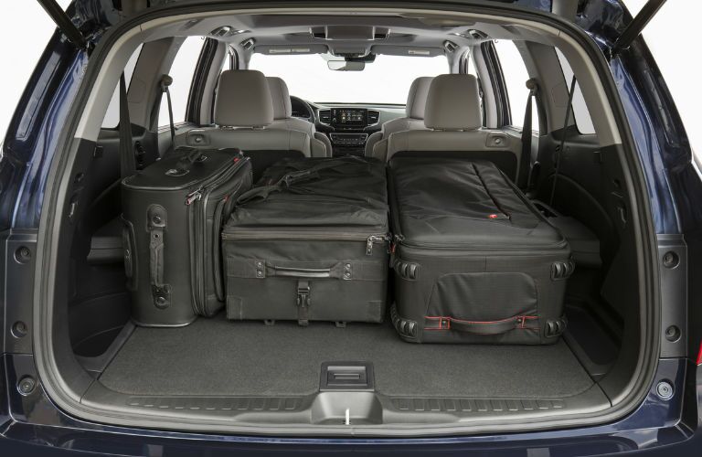 A photo of the luggage in the cargo area of the 2020 Honda Pilot.