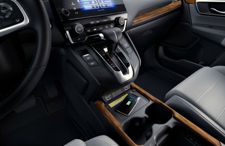 A photo of the lower console and wireless phone charging tray in the 2021 Honda CR-V.