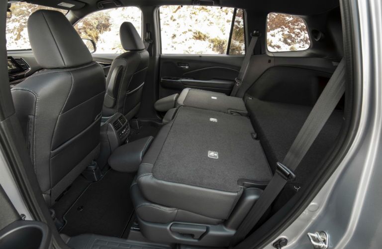 A photo of the back seats folded down in the 2019 Passport.