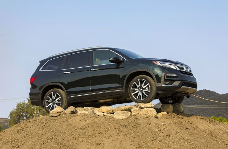 A photo of the 2020 Honda Pilot parked on a hill.