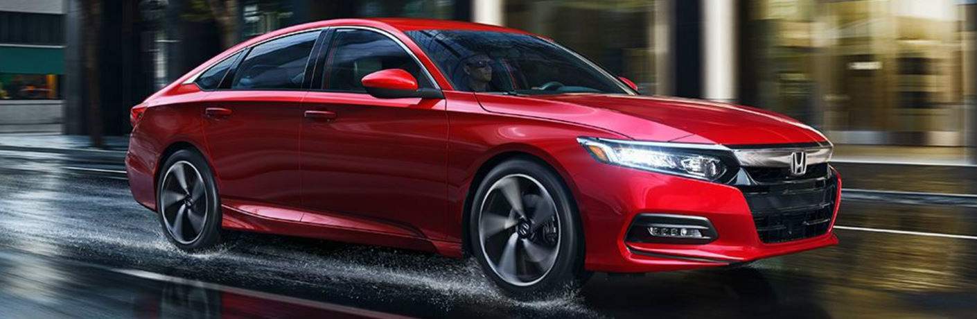 red 2018 Honda Accord driving on wet road