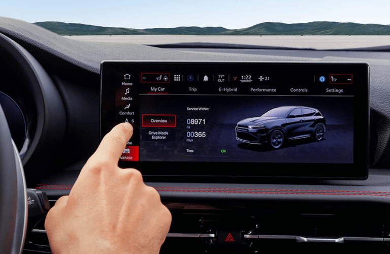 A person using the 2024 Dodge Hornet touchscreen
