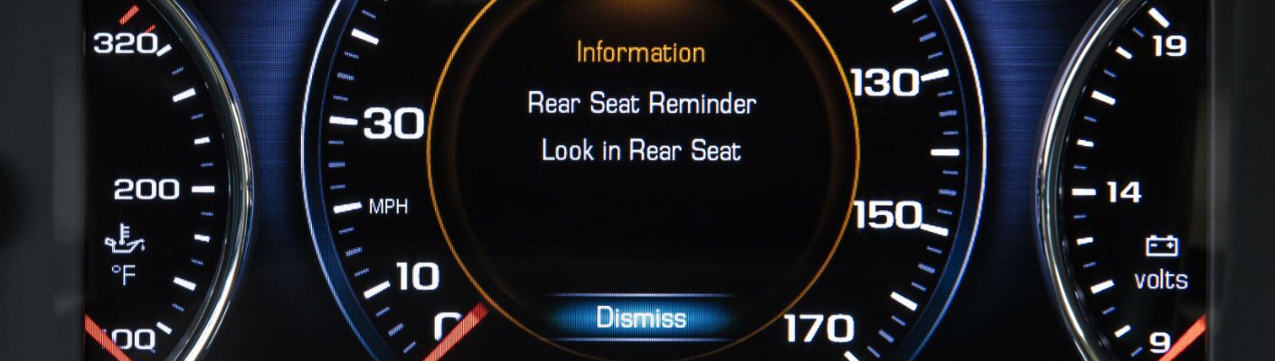A close up photo of the symbology of the rear-seat reminder system in the 2019 GMC Acadia.