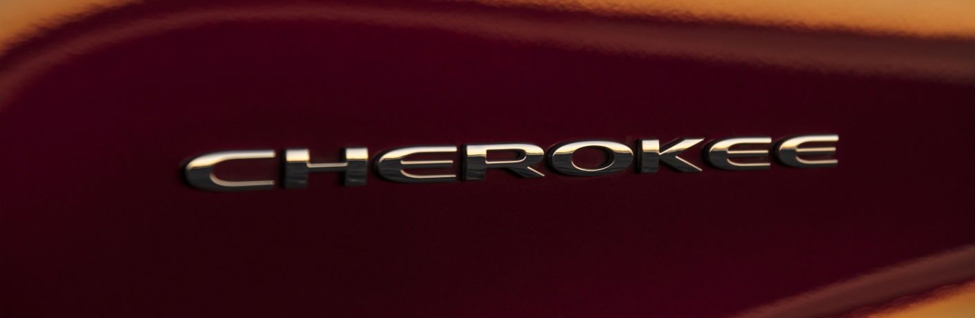 A close up photo of the Cherokee badge worn by the 2019 Jeep Cherokee.