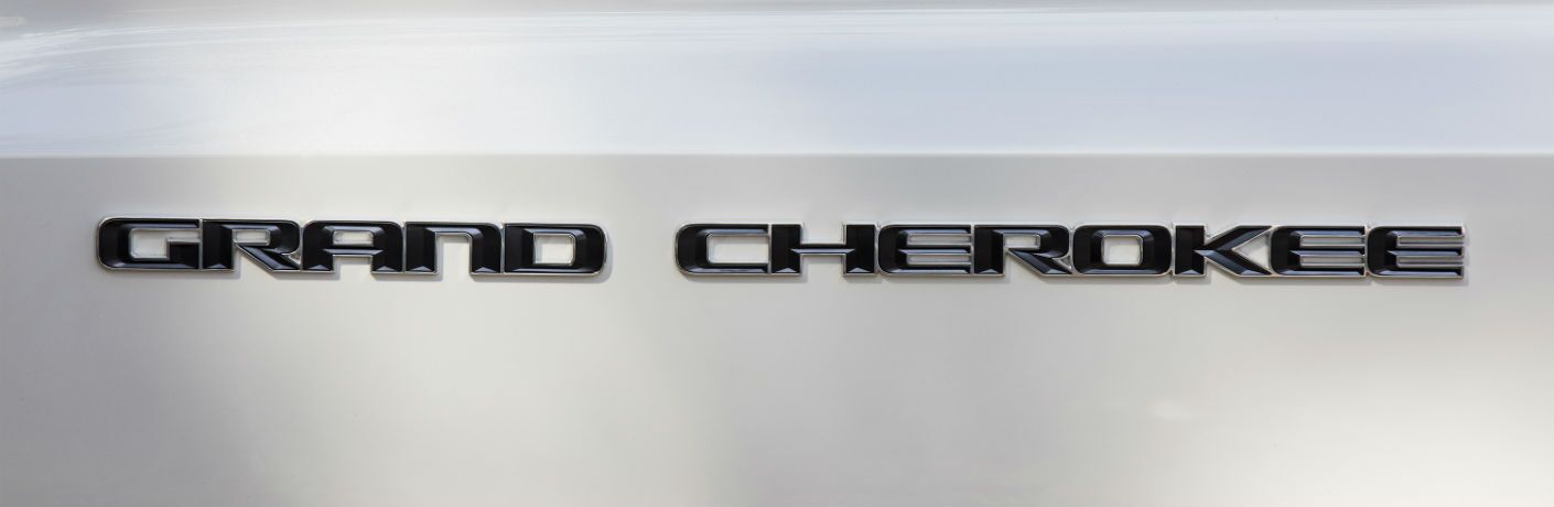 A close up photo of the Grand Cherokee badge on the 2019 Jeep Grand Cherokee.