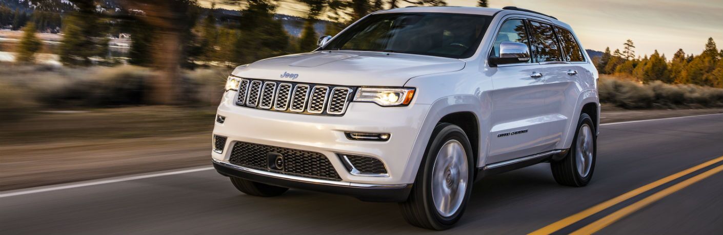 A front right quarter photo of the 2019 Jeep Grand Cherokee on the road.