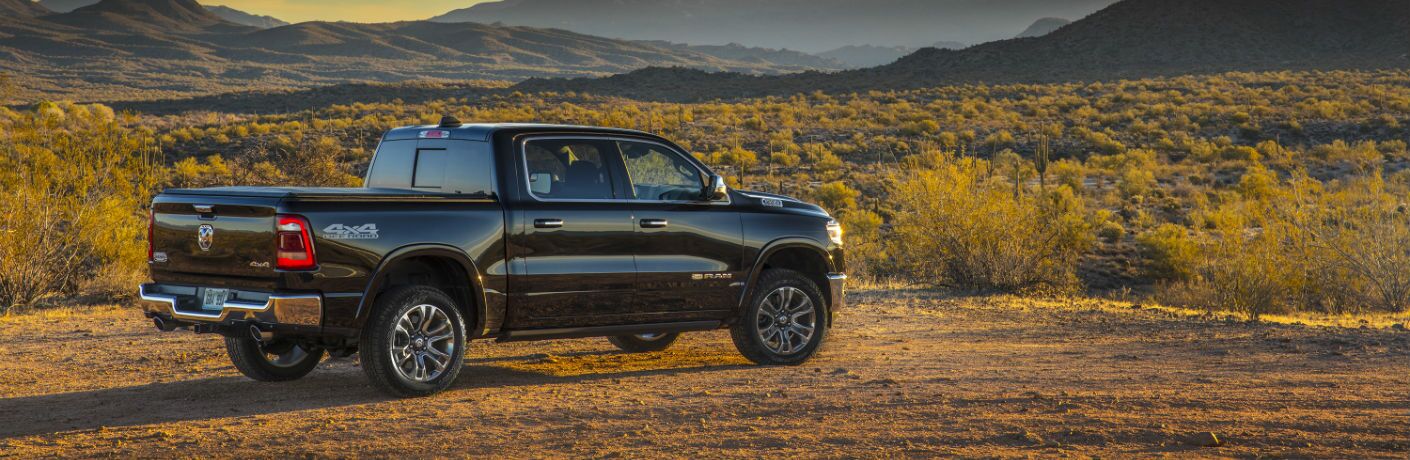 A right profile photo of the 2019 Ram 1500 parked in the desert.