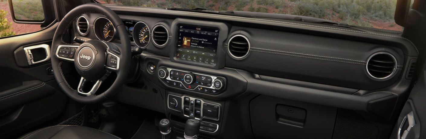 An interior photo showing the updated dashboard of the 2019 Jeep Wrangler.