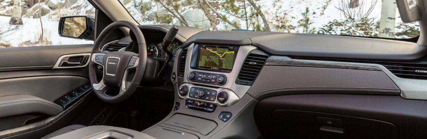 An interior photo of the front dashboard in the 2019 GMC Yukon.