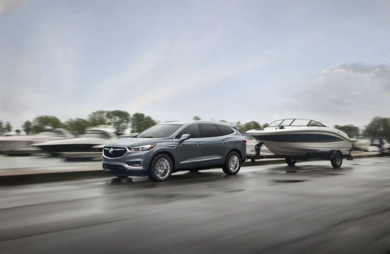 A photo of a the 2019 Enclave pulling a boat.