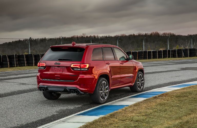 A rear right quarter photo of the 2019 Grand Cherokee Trackhawk going around the track.