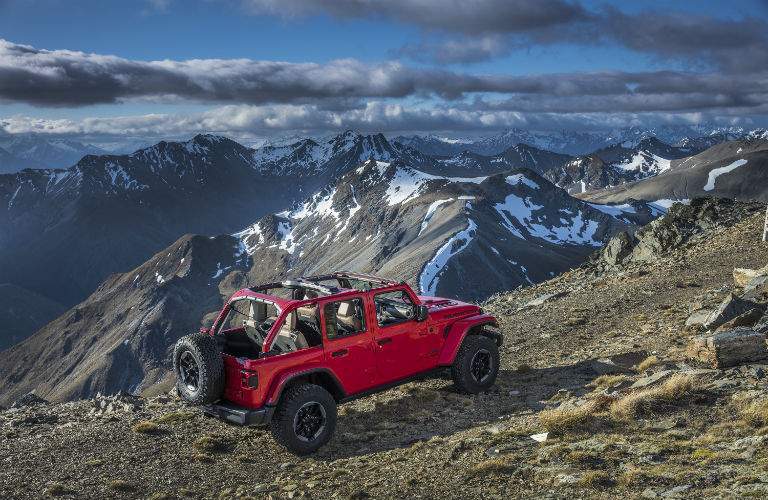 An elevated view of the 2018 Jeep Wrangler driving over a mountainous trail